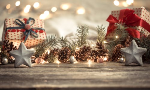 Composition with Christmas decorations in the interior. On a wooden background with lights . The concept of winter holidays and home comfort .